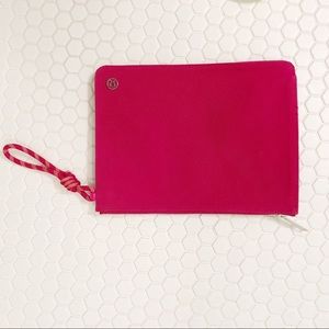 Lululemon slim, raspberry colored sporty pouch